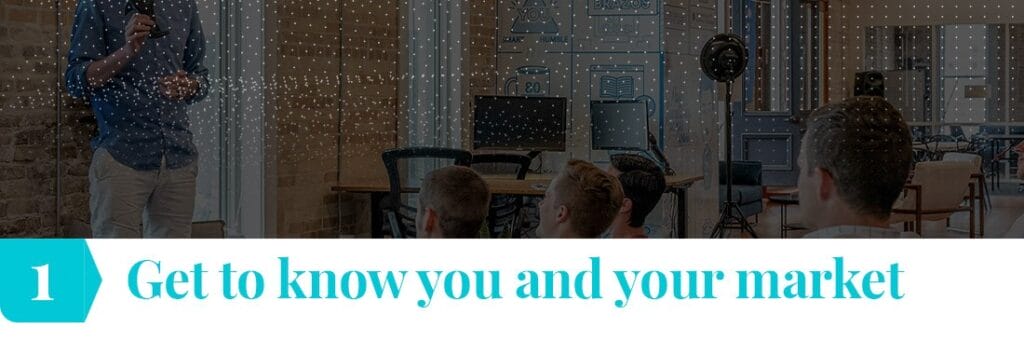 Shows a person is giving a presentation or lecture to an audience seated in a modern office environment. The room is well-lit, with a casual yet focused atmosphere. At the bottom of the image, there is bold text in turquoise that reads, "1 Get to know you and your market,"
