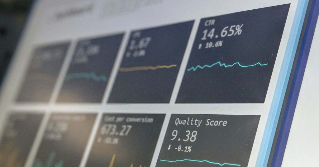 Close-up of a screen displaying various data graphs and statistics in a dashboard layout.