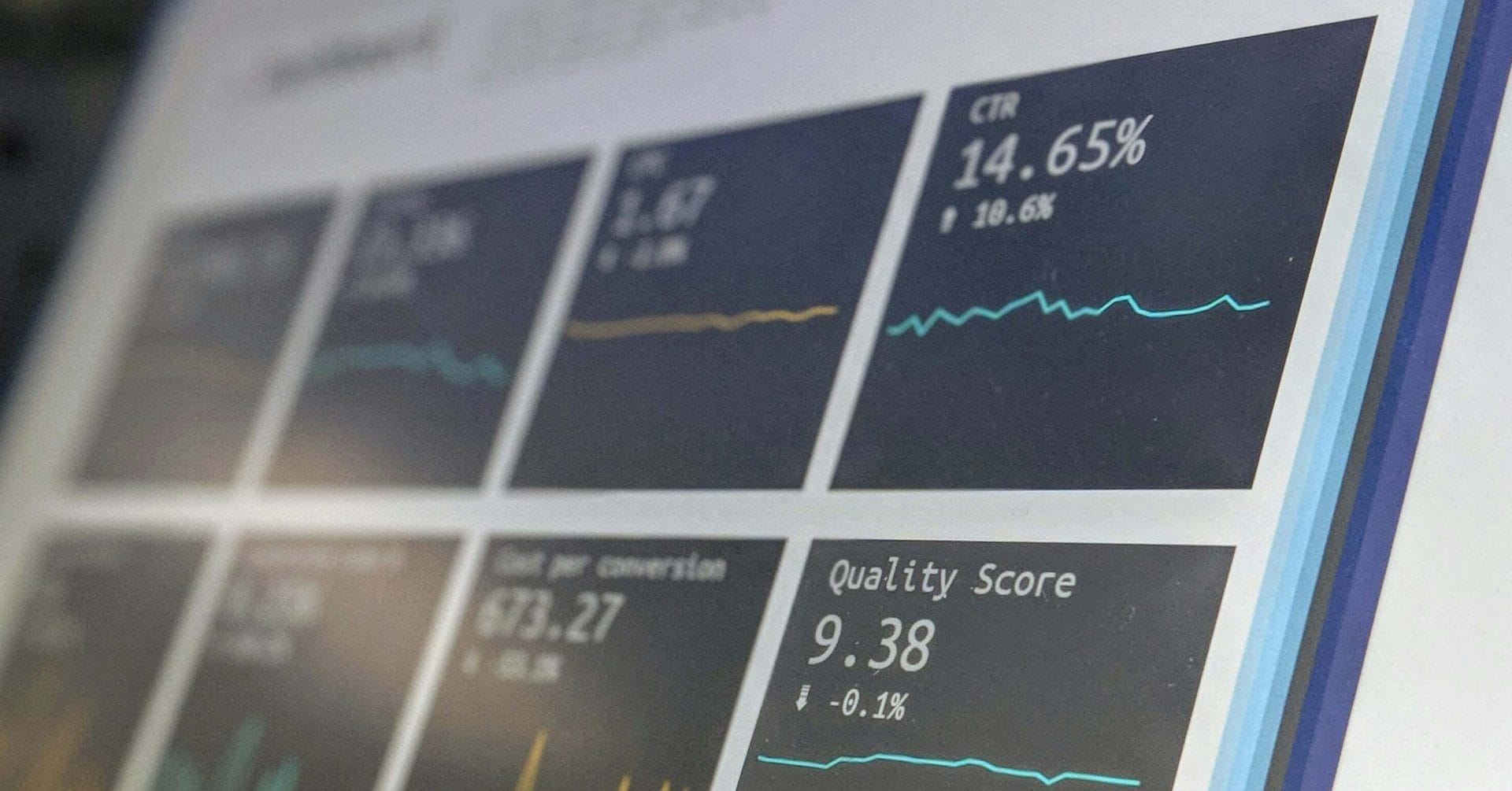 Close-up of a screen displaying various data graphs and statistics in a dashboard layout.